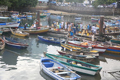 salvador, bahia, brazil - april 30, 2022: Fishing boats in a harbor at the Sao Joaquim fair in the city of Salvador.
