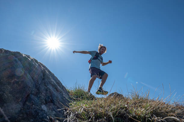 istock Man cross-country runner explores a high mountain ridge 1395122134