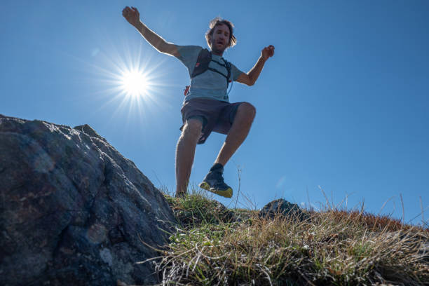 istock Man cross-country runner explores a high mountain ridge 1395122170