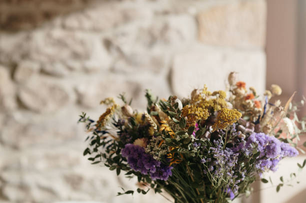 A bouquet of flowers made of dried flowers of various kinds.