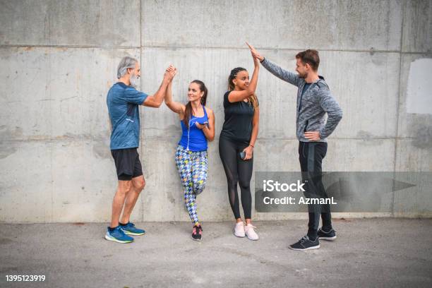 Athletic Group Of Friends Motivating And Supporting Each Other Stock Photo - Download Image Now