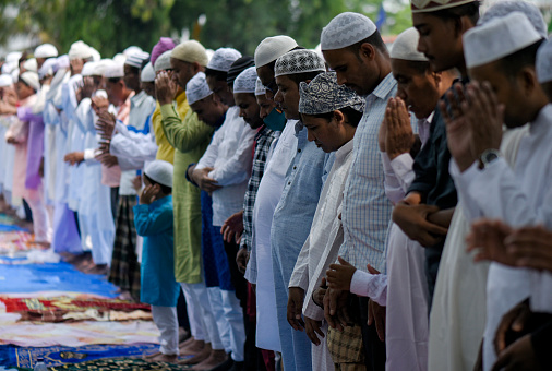 Guwahati, India. 03 May 2022. Muslims offer prayer at a Eidgah to start the Eid al-Fitr festival, which marks the end of their holy fasting month of Ramadan, in Guwahati.