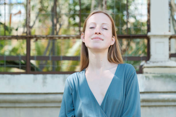 istock Beautiful young woman with her eyes closed. 1395125090