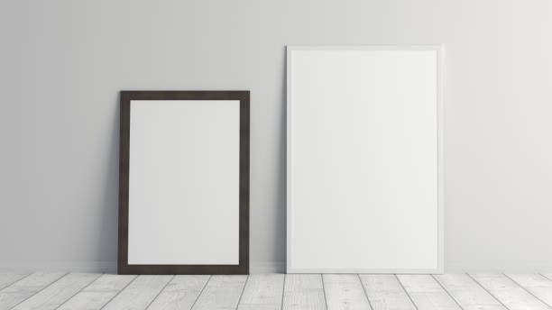 istock Mock up white and black vertical frames on the white floor with white wall. 1395125937