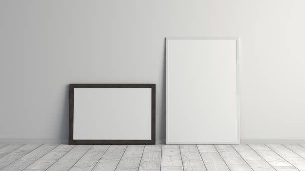 istock Mock up of horizontal and vertical black and white frames on the floor with white wall. 1395125952