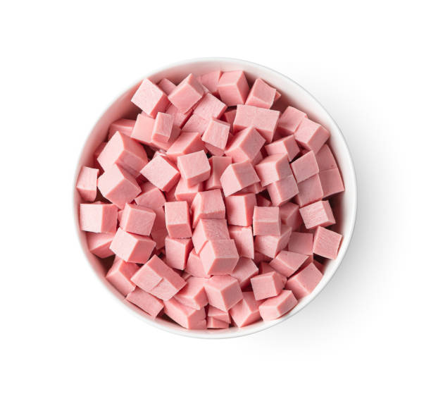 istock Sausage diced in a bowl is isolated on a white background. 1395127585