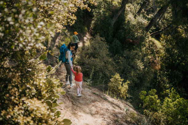 istock Young family exploring woods at springtime 1395128832