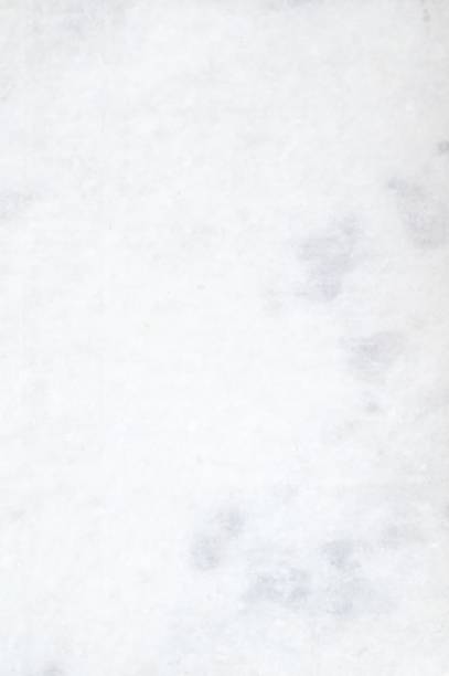 Empty blank plain white or light grey coloured blotchy grunge textured effect vertical backgrounds like a plastered and painted dirty wall with smudges, blotched texture and aberrations of plaster Plain white gray grunge blotched smudged plastered wall like vertical backgrounds. Apt to use as wallpaper, background, post cards, letters, manuscripts, historical ancient backdrops. painted drywall texture stock pictures, royalty-free photos & images