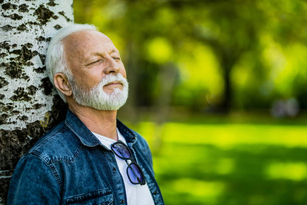 istock Tranquil senior man relaxing in nature. 1395132309