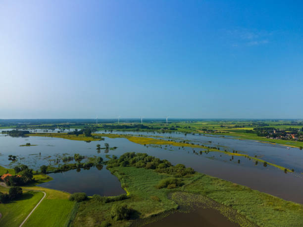 istock River IJssel with high water level on the floodplains 1395132478