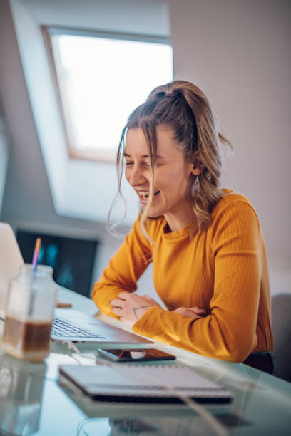 istock Woman having web call on a laptop while working at home 1395132727