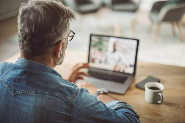 istock Mature man working from home office 1395133581