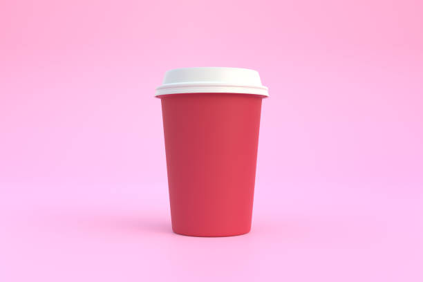 istock Disposable paper coffee cup with white lid on pink background 1395135106