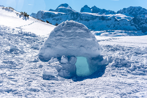 iglu snow house with snow bricks and lens flare