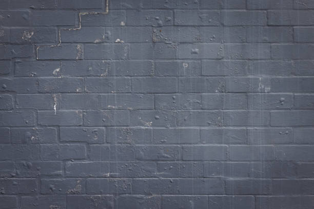 Old stained gray brick wall.