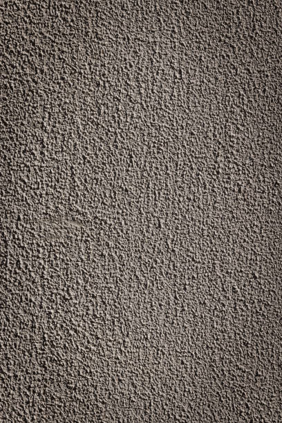 part of a rough brown concrete wall - color image solid brown bumpy imagens e fotografias de stock