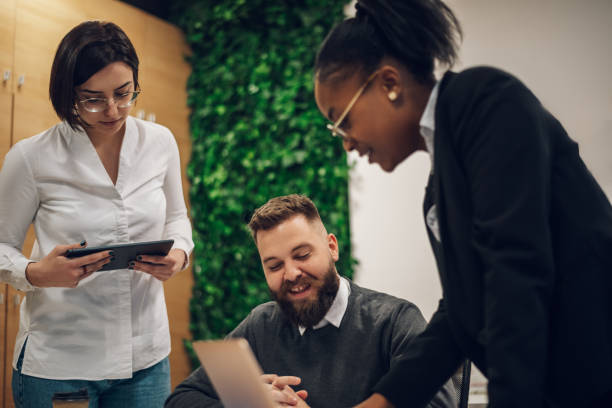 istock Multicultural team working together in office and having a meeting 1395146266