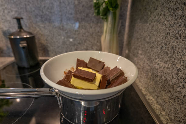 istock Woman making a chocolate cake at home 1395146711