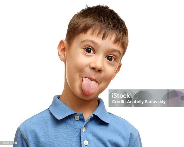 Happy Child Someter La Lengua Foto de stock y más banco de imágenes de Niño - Niño, Sacar la lengua, Niños