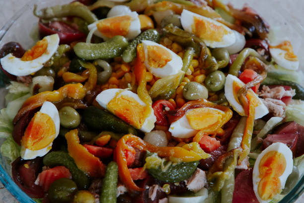istock Salad plate with cucumbers, peppers, egg, tomatoes, olives 1395148911