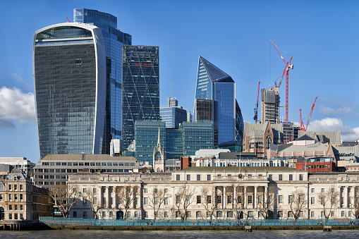 Towers of London financial district skyscrapers overlooking River Thames