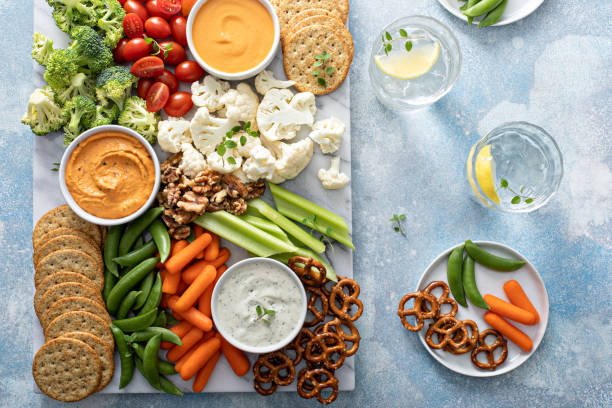 istock Plant based snack board with vegetables and crackers 1395154194