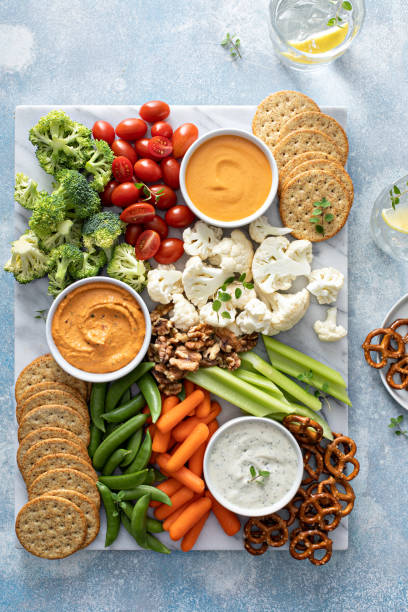istock Plant based snack board with vegetables and crackers 1395154195