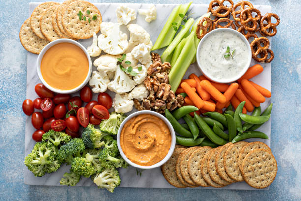 istock Plant based snack board with vegetables and crackers 1395154196