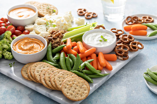 istock Plant based snack board with vegetables and crackers 1395154197