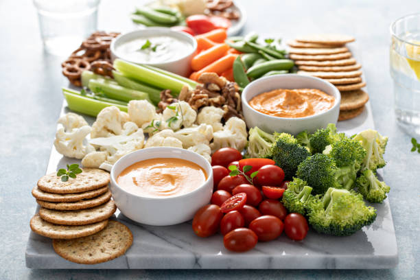 istock Plant based snack board with vegetables and crackers 1395154198