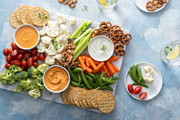 istock Plant based snack board with vegetables and crackers 1395154203