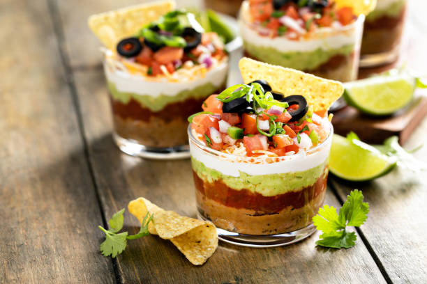 istock Seven layer dip in individual cups, mexican appetizer 1395154239