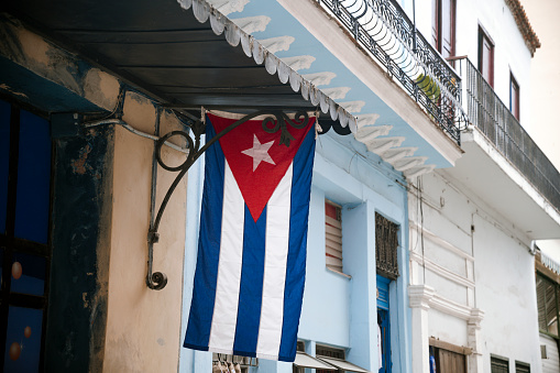 Cuban flag in Old Havana. Travel in Havana, Cuba. Cuban culture.
