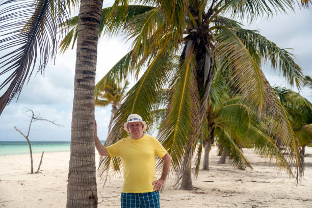 Man selling hats and other stuff on Bayahibe Beach in The Dominican Republic.