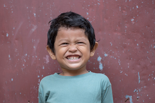 Portrait of cheerful asian boy