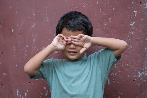 Asian boy blindfolded portrait
