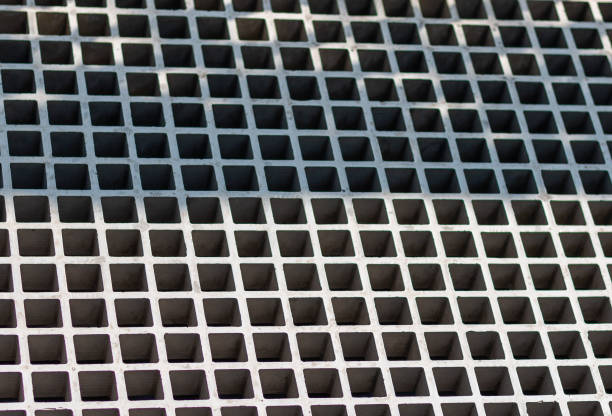 istock Mesh textured metal panel. Gray steel industrial surface 1395163225
