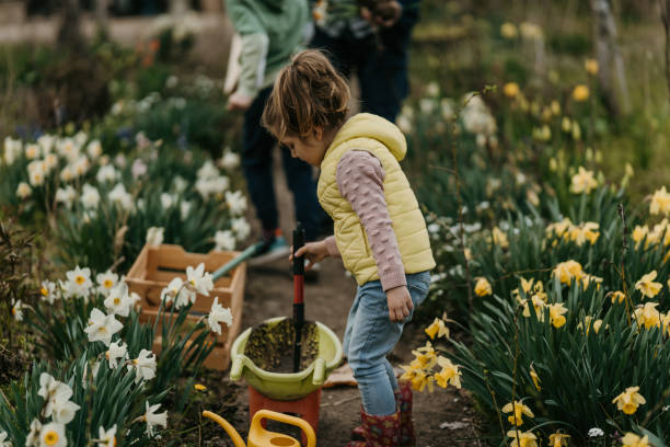 istock Little girl in garden 1395164097