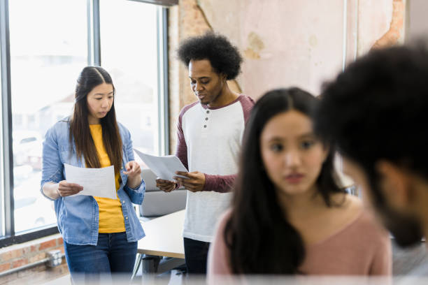 istock Actors pair up to go over lines for play 1395164225