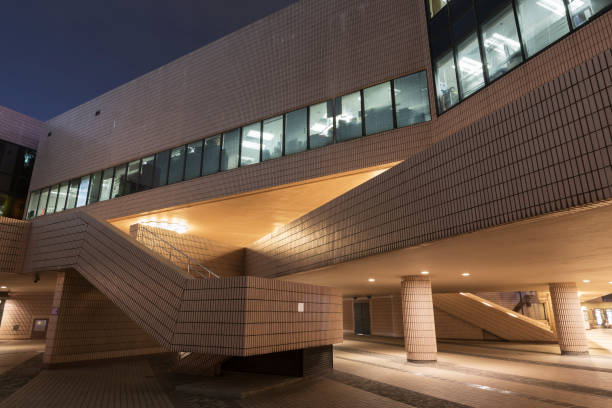 istock Exterior of modern building at night 1395165025