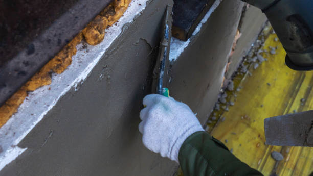 istock Plastering cement at wall for renovation house. Plasterer smoothing plaster on wall. Putty brick wall background 1395166678