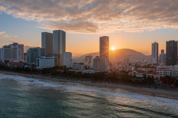 Drone view of Nha Trang city at sunset from the sea, Khanh Hoa province, central Vietnam