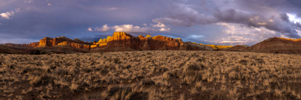 istock Panorama of Golden Grass and Red Cliffs in Capitol Reef 1395170200