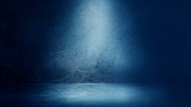 dark blue emperado marble floor and wall backgrounds, room, interior with light from above used for products displayed. realistic empty room of stone with artificial light. studio portrait backdrops.