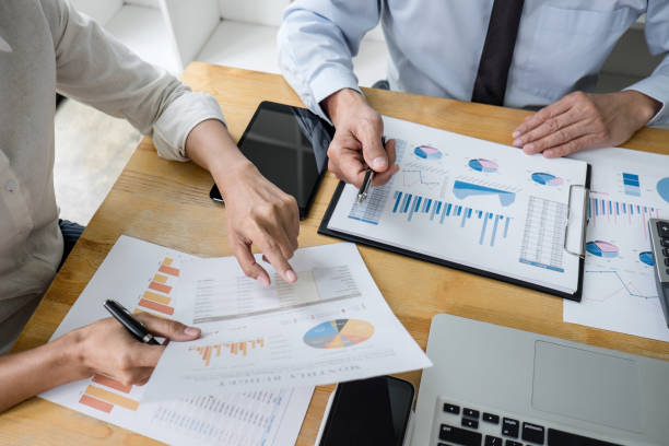 istock Two business team manager having a discussing with new project success financial statistics, Partner meeting professional investor working start up project for both company with document 1395172768