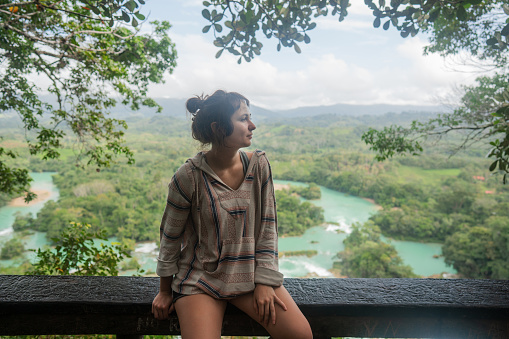 Young Caucasian woman near  Las Nubas waterfall in Chiapas, Mexico during her travel