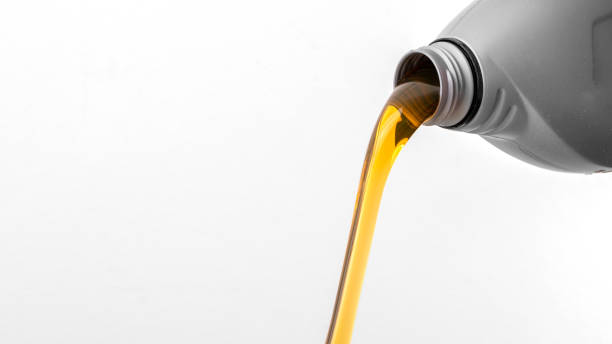 istock Pouring motor oil from plastic bottle 1395176475