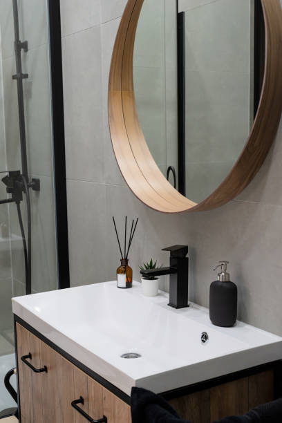 istock Large mirror over vessel sink in stylish bathroom interior 1395180448