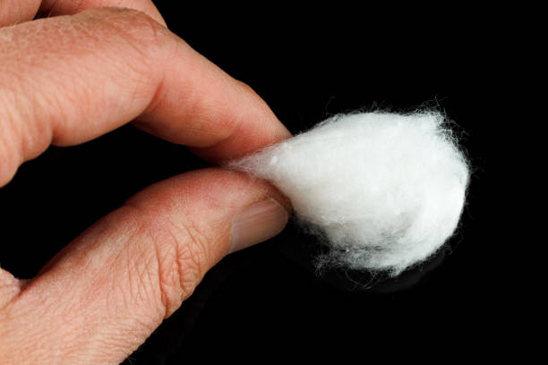 istock medical cotton wool in hand 1395180670