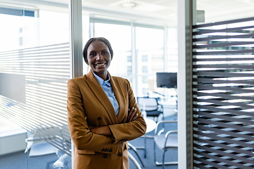 Black female CEO in front of her office